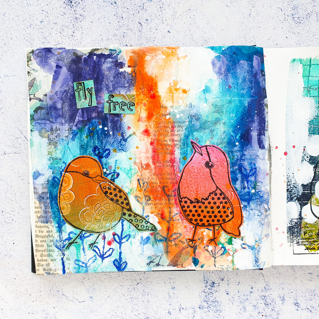 mixed media art journal page with bird stamps